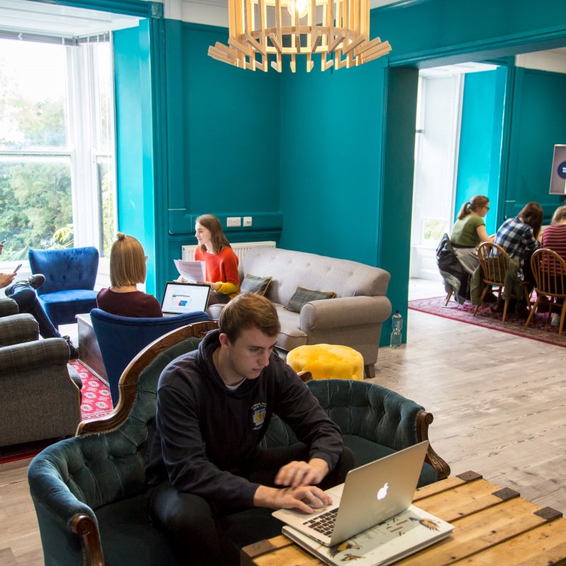 Students working in the writers room on Falmouth campus.