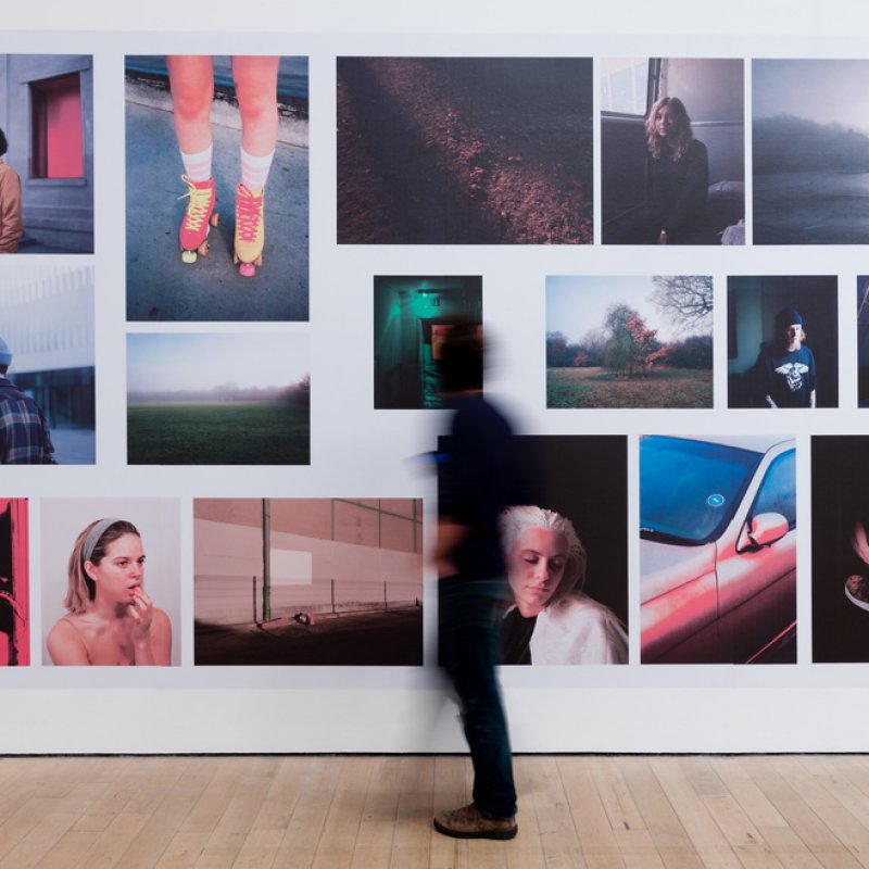 A person in a photography gallery