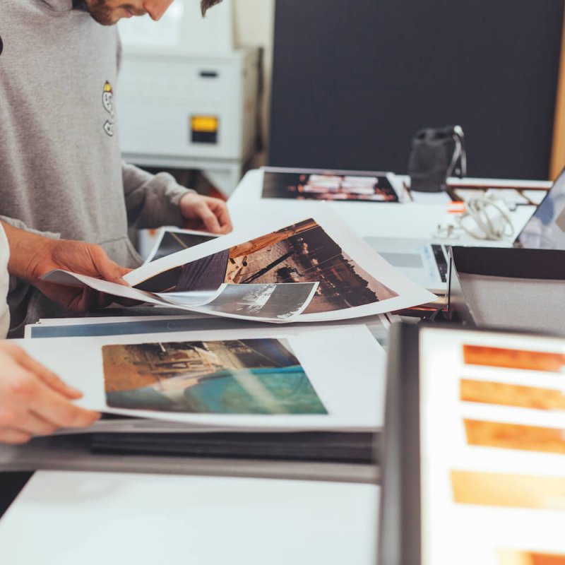 Students looking through images from a portfolio.