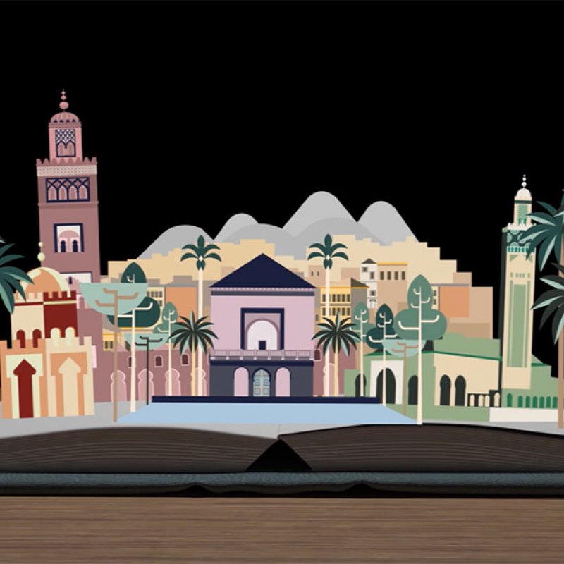 A pop up book of buildings and palm trees