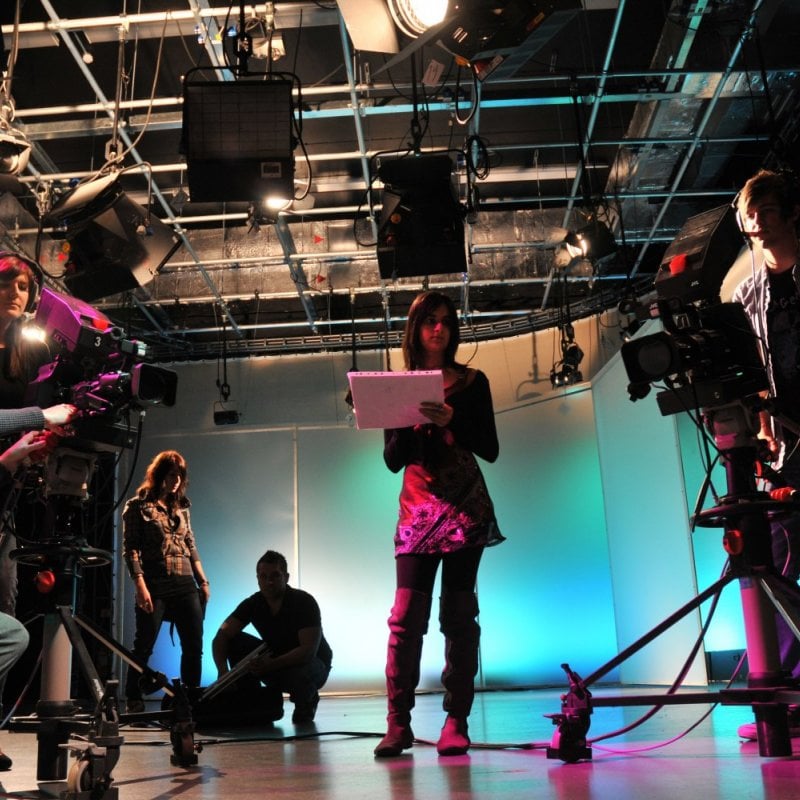 Falmouth Film students operating cameras in a studio