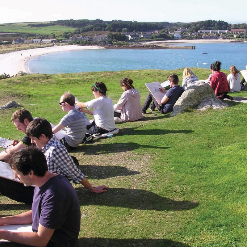 Falmouth University students on Tresco island drawing the scenery.