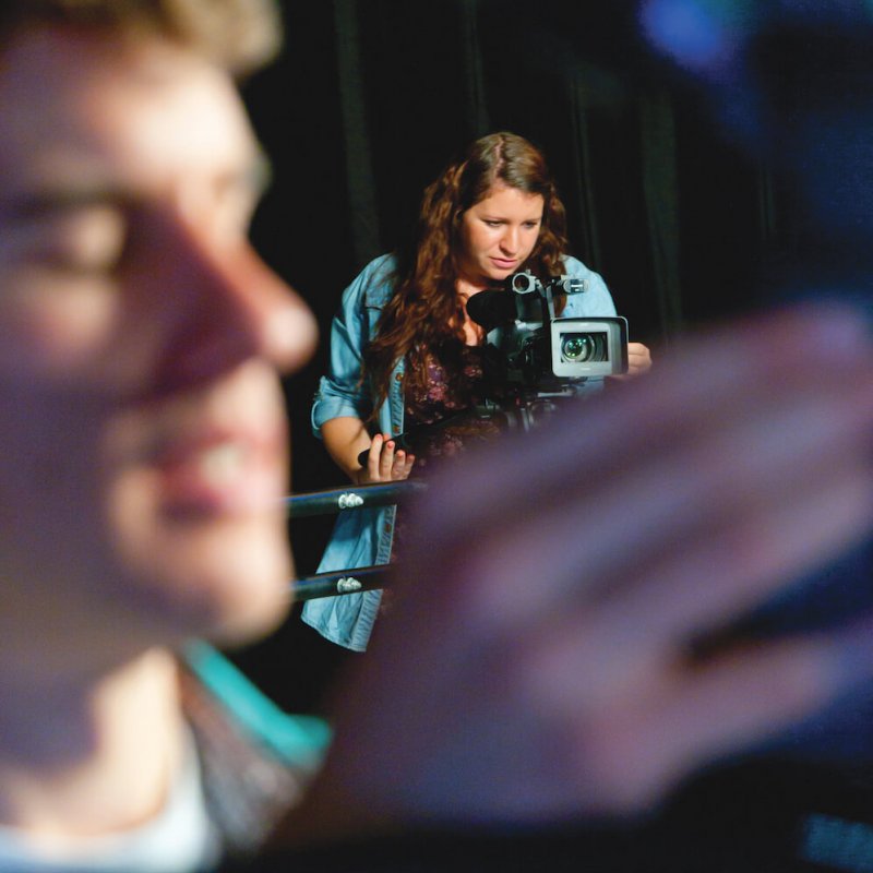 A male and female Film students using camera equipment