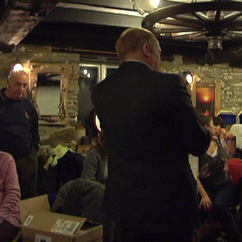 A mature group in an old exposed brick room.