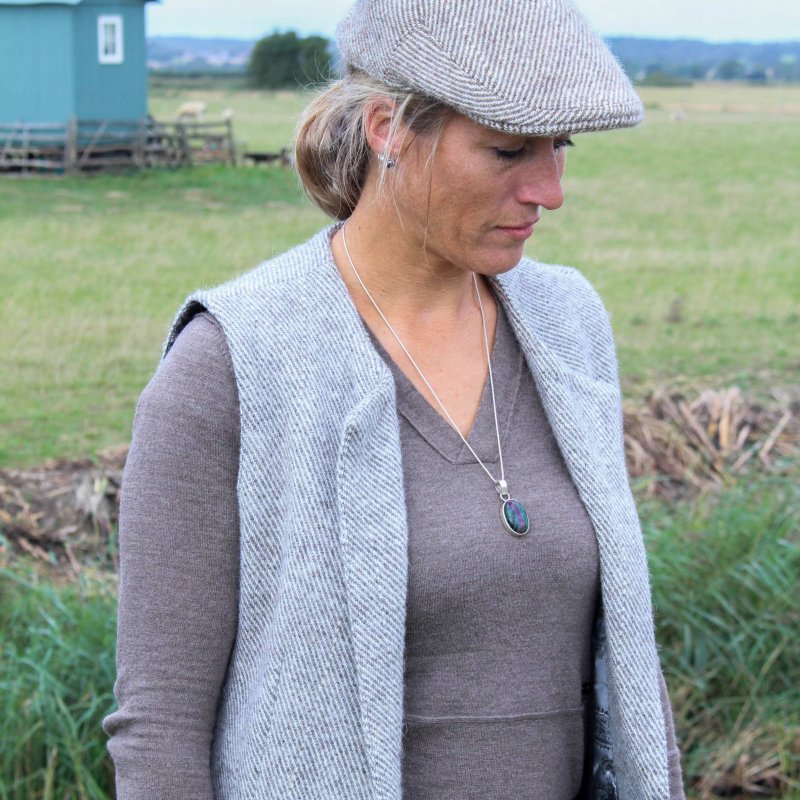 A woman models a wool cardigan