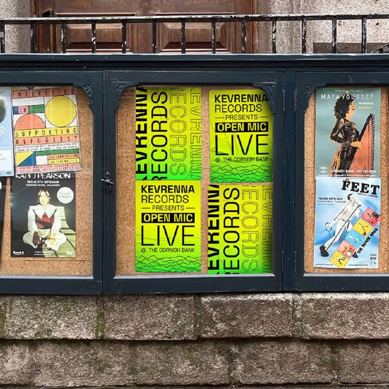 Posters for Kevrenna Records displayed in community message board box