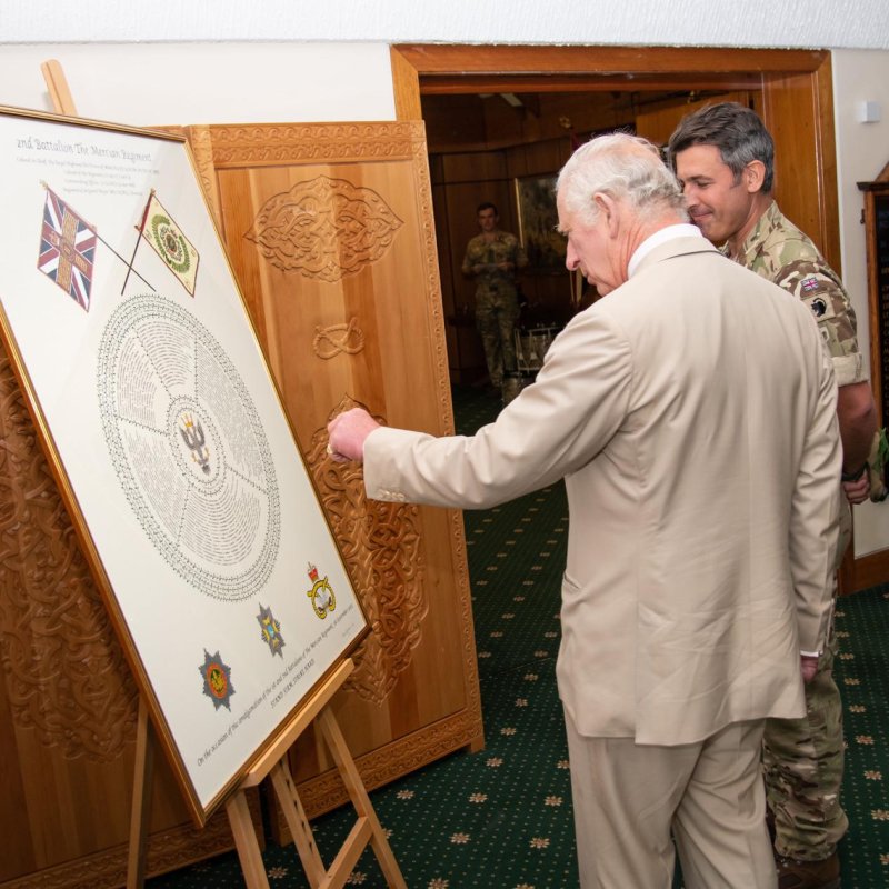 King Charles looking at Clare's work