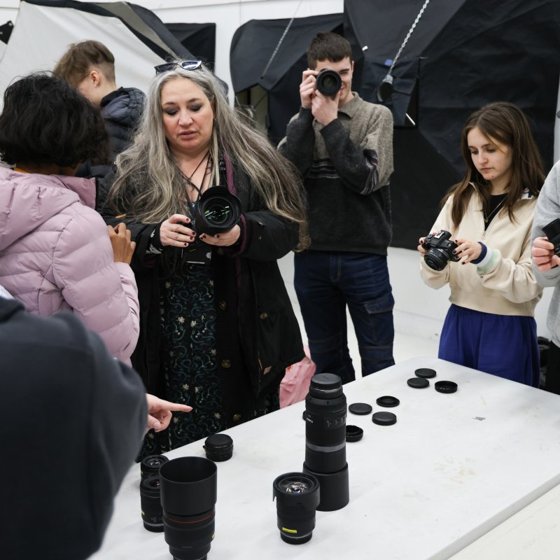 A group of people looking at cameras