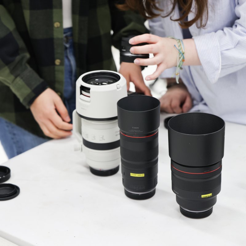 A selection of camera lens' on a white table