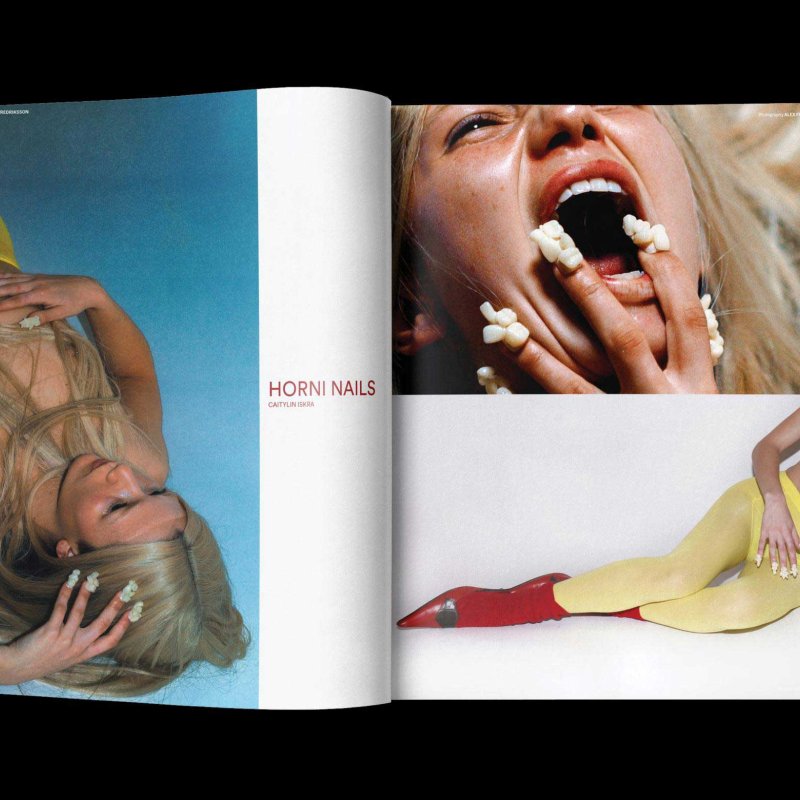 A magazine double page spread featuring a model with stylised nails