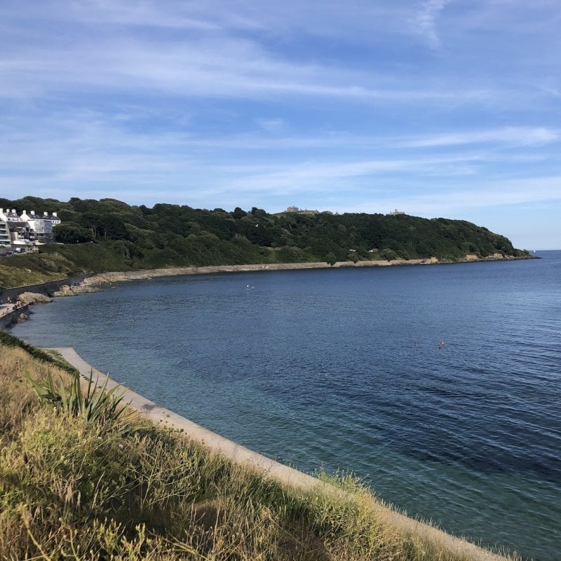 View of Castle Beach in Falmouth with Pendennis Castle in the background