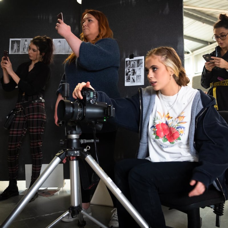 Students with cameras in a studio