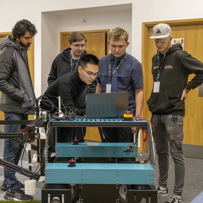 Robotics Hackathon group working on the robot