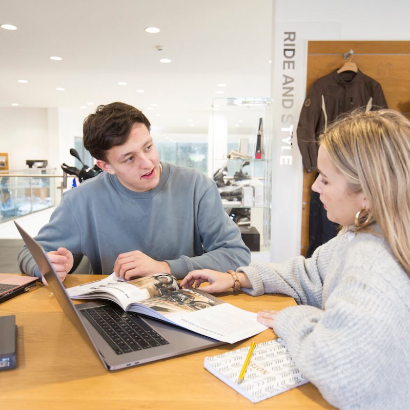 Student sitting in work placement at BMW garage