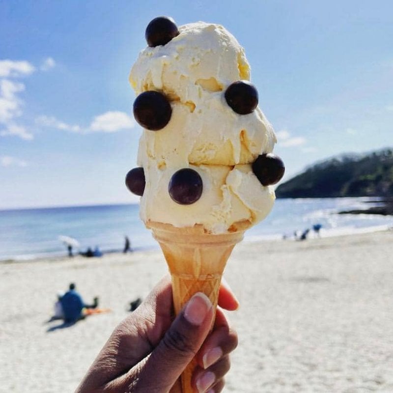 A large ice cream in a cone with maltesers