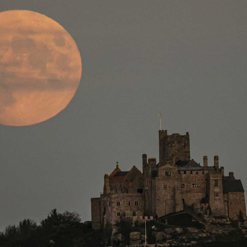 A 98.6 hunters moon can be seen behind St Michael’s Mount in Penzance, Cornwall. The name 'Hunters Moon' comes from ancient hunters stalking their prey in the moonlight