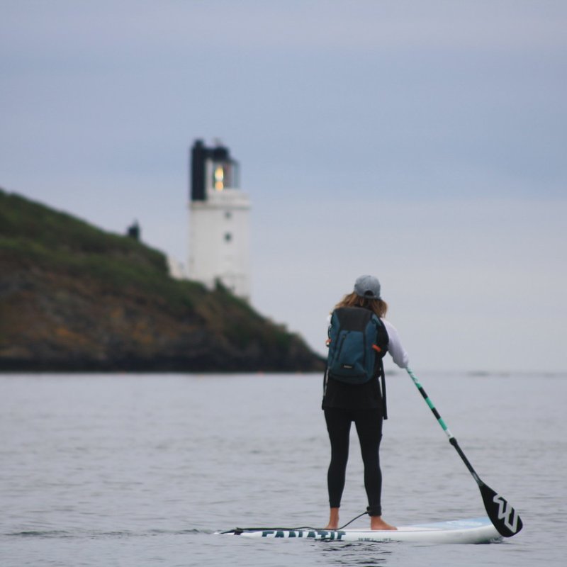 student paddleboarding