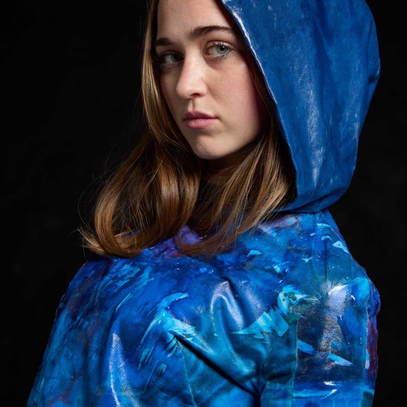 A woman wearing a blue jacket