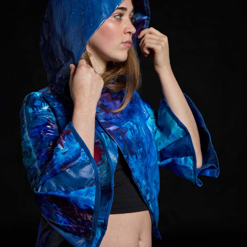 A woman wearing a blue jacket