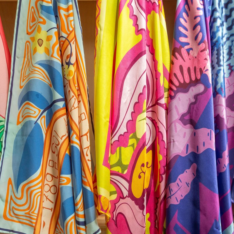 Five different silk scarves with colourful textile design