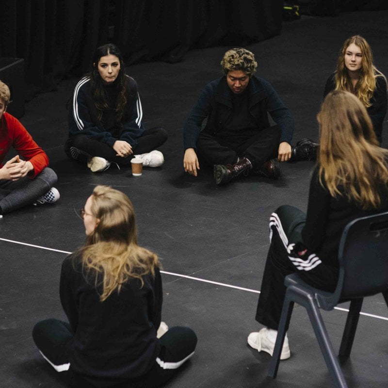 Group of students sat in discussion