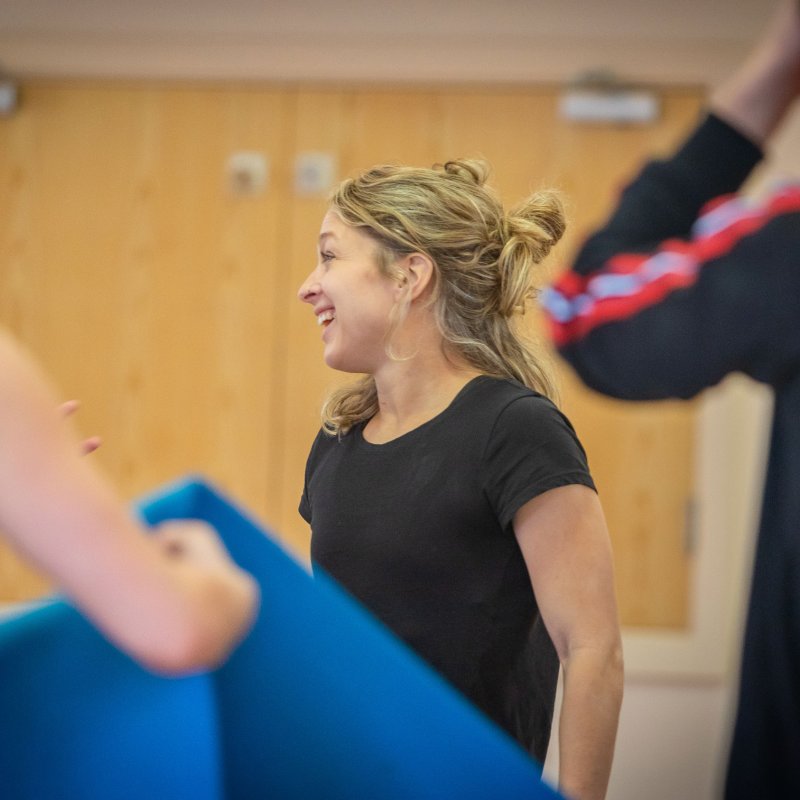 A small group of people looking away from the camera after completing a dance fitness class
