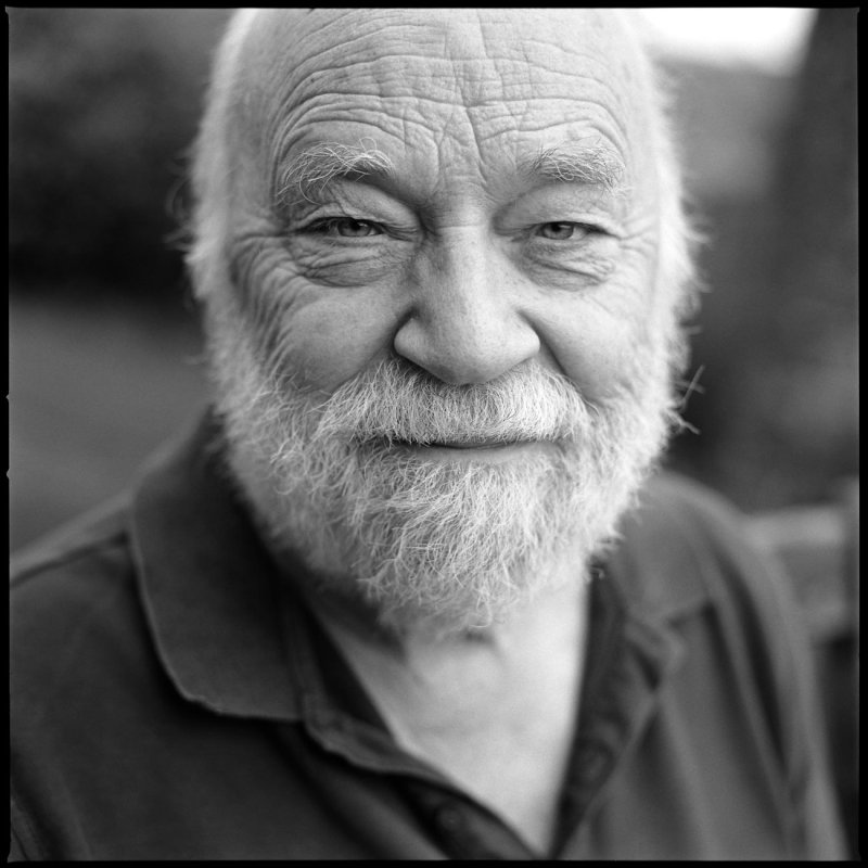 Black and white photo of an old man with a beard