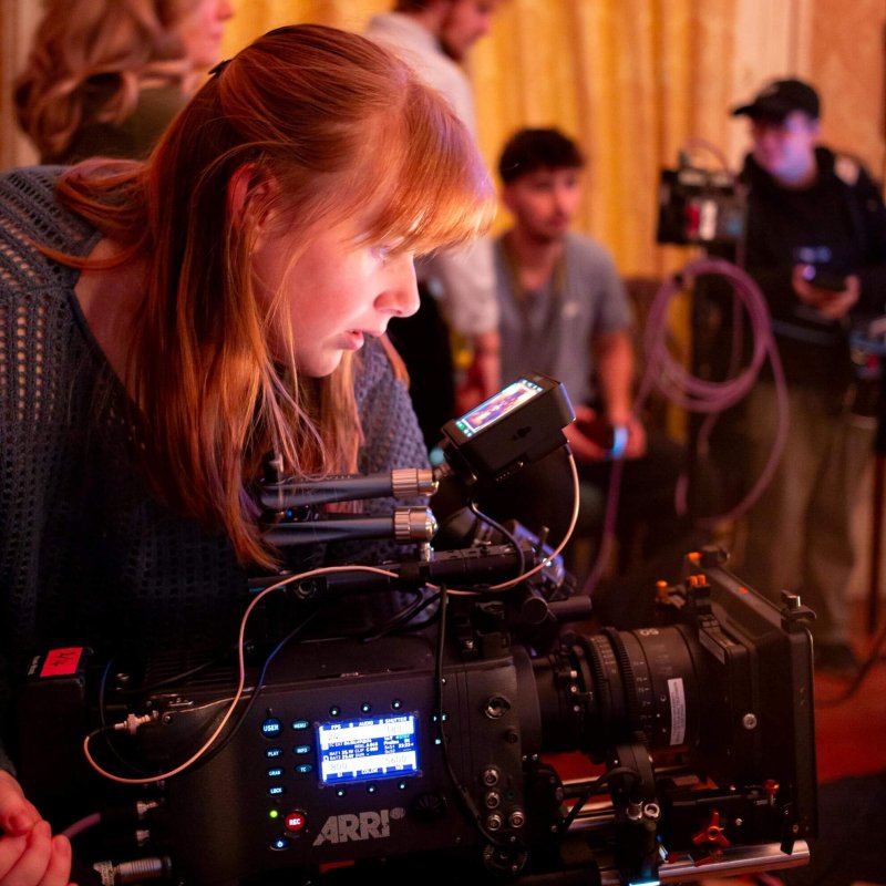 A Falmouth University student operating an ARRI camera on set