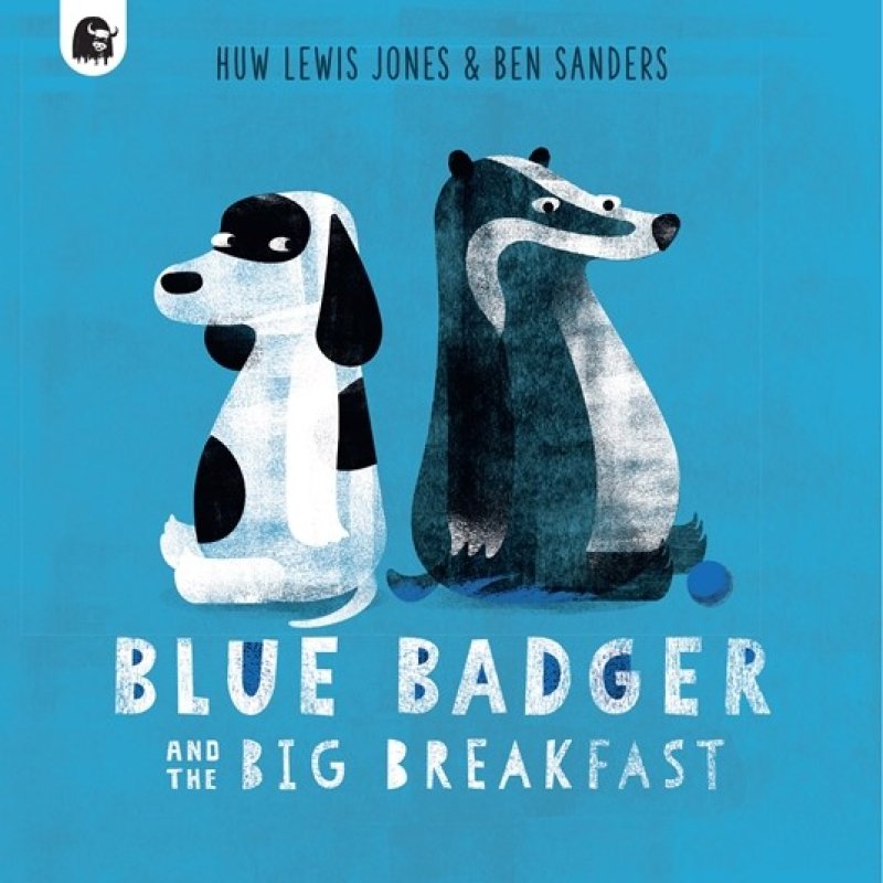 Book cover: Blue background, with black and white illustration of a dog and a badger in the centre. Text at top read: Huw Lewis-Jones & Ben Sanders. Text at bottom reads: Blue Badger & The Big Breakfast. 