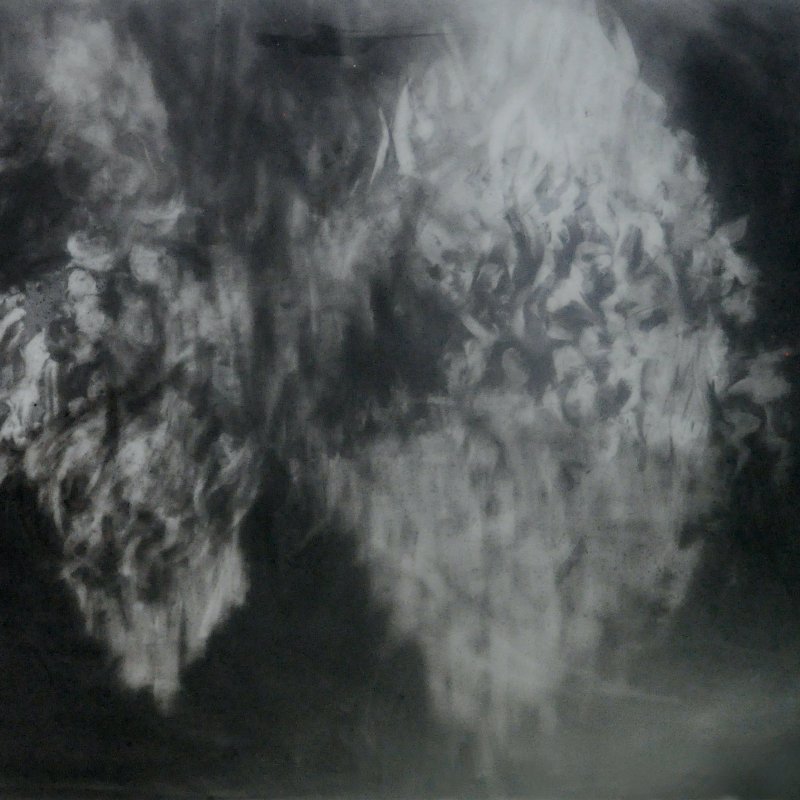 Artwork by student showing a foggy form on a black background 