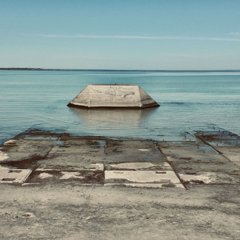 Artwork showing a concrete structure in the sea