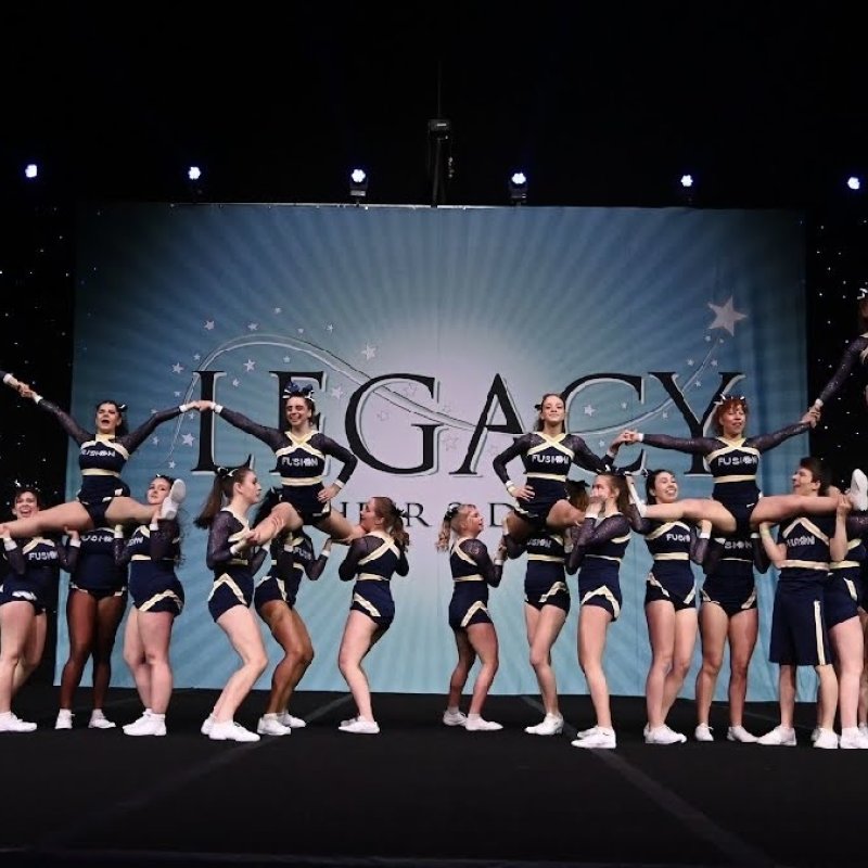 The Falmouth University cheerleading club performing on a stage