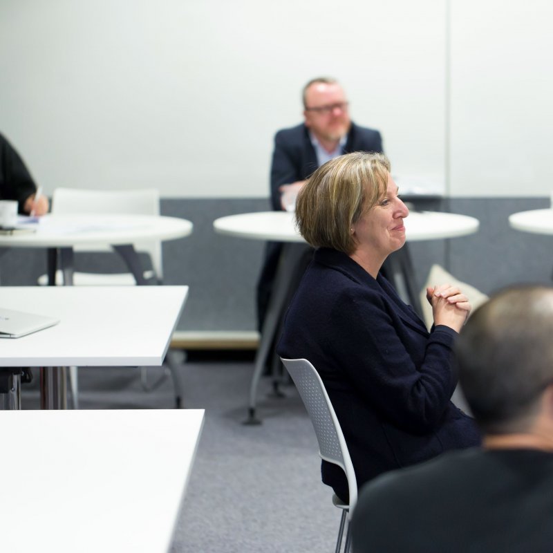 Close up of Vice Chancellor and Chief Executive Emma Hunt, who sits amongst a panel of experts at a business meeting