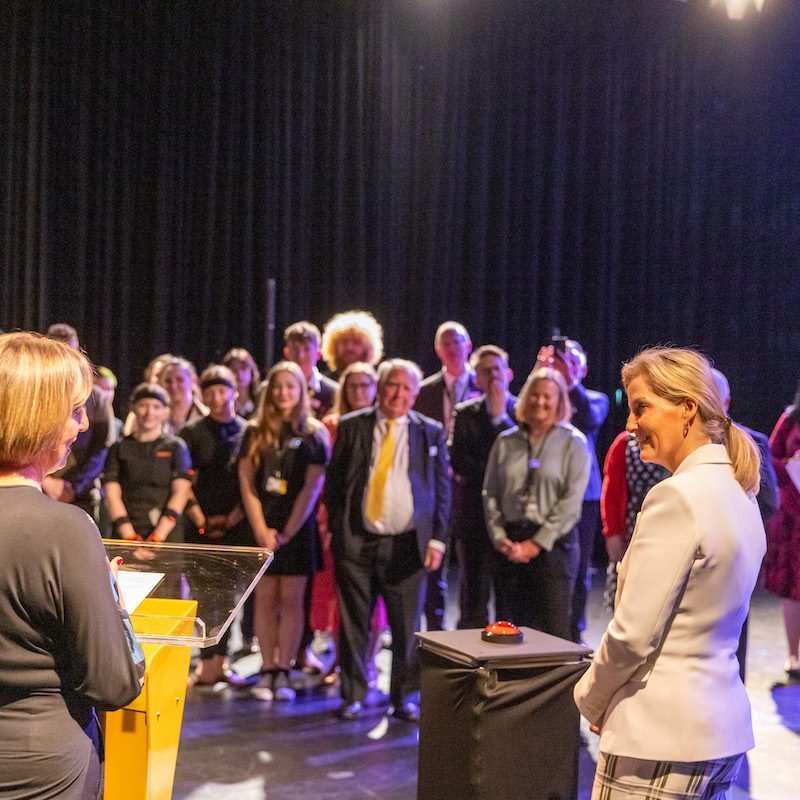 The Duchess of Edinburgh in front of a group of people at Falmouth University