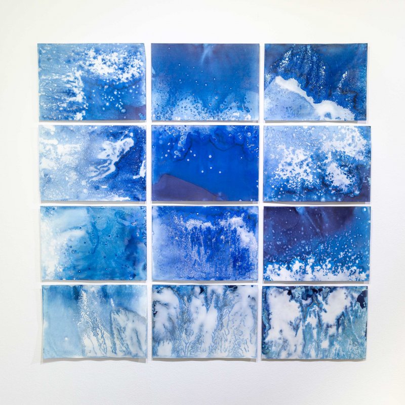 Tiled blue images arranged in a 3-3-3 formation