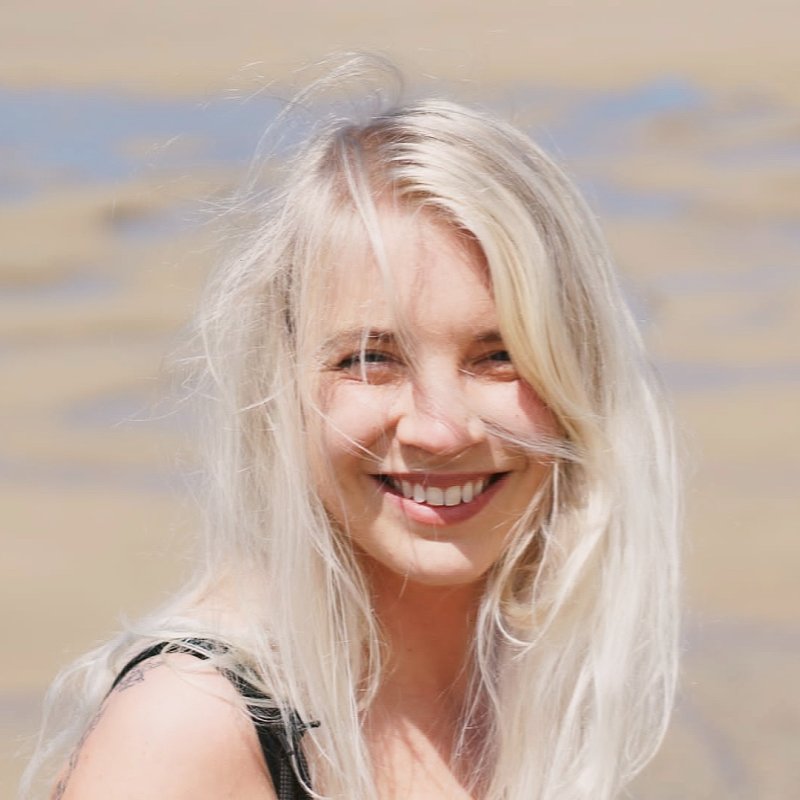 A woman smiling into the camera