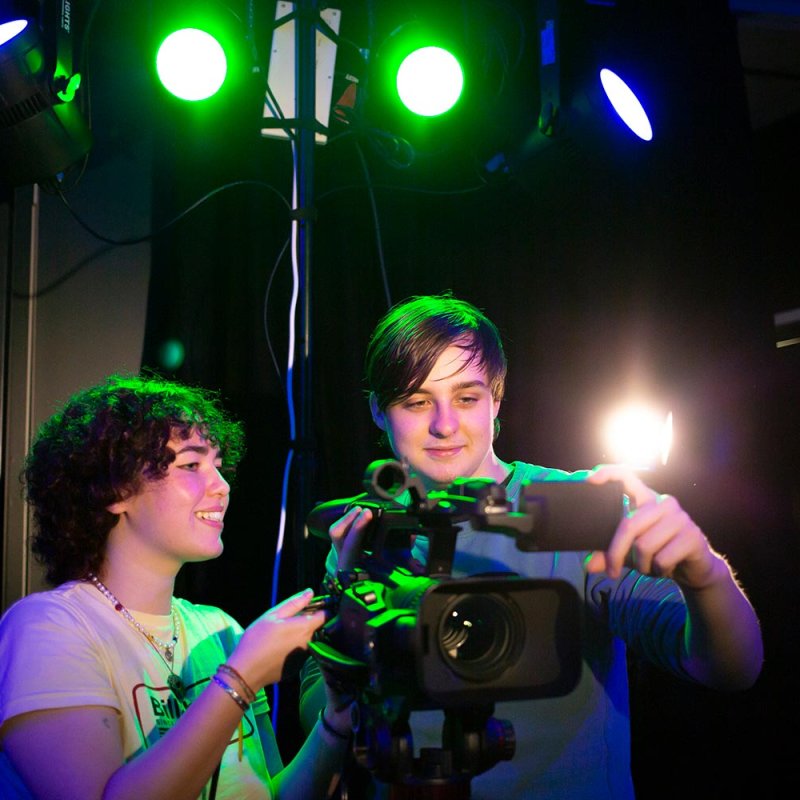 A male and female Esports student using camera equipment