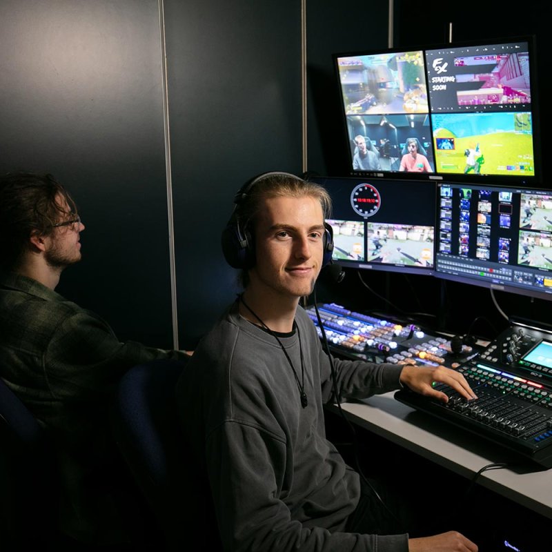 Two male students working in an Esports lab at Falmouth University