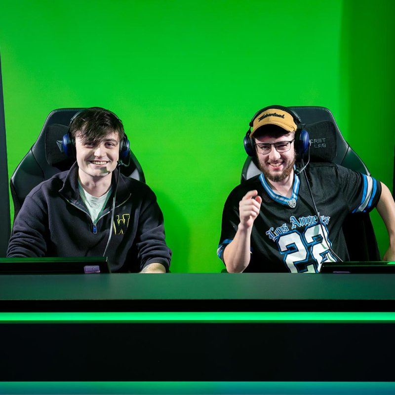 Two male students in an Esports studio with green screen