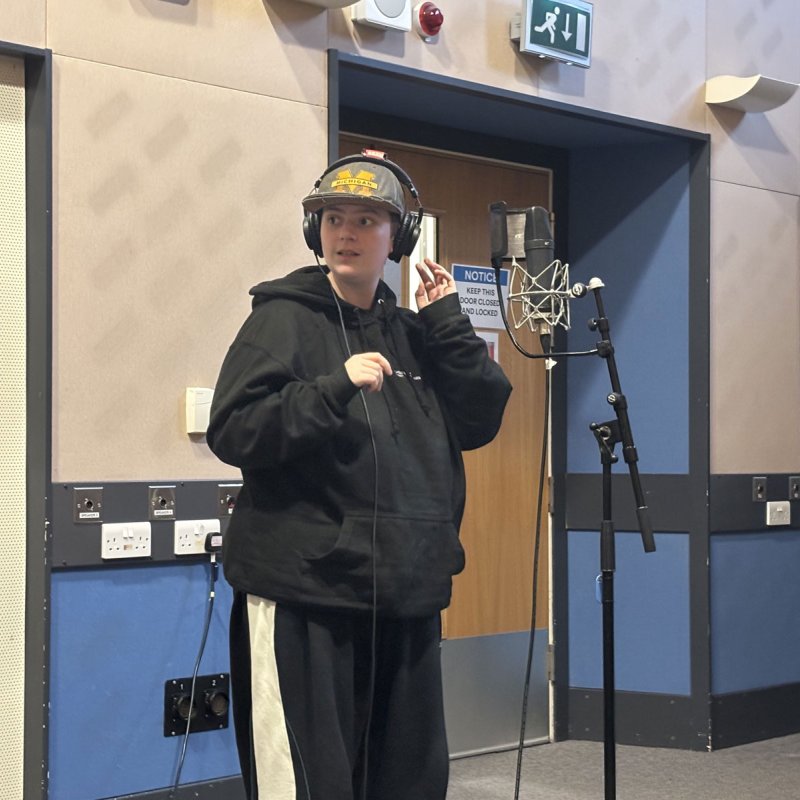 A Musical Theatre student in the recording studio at Falmouth University