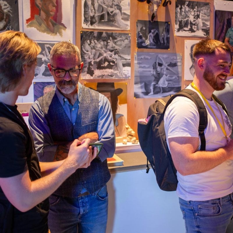 A group of people at the Game Art exhibition