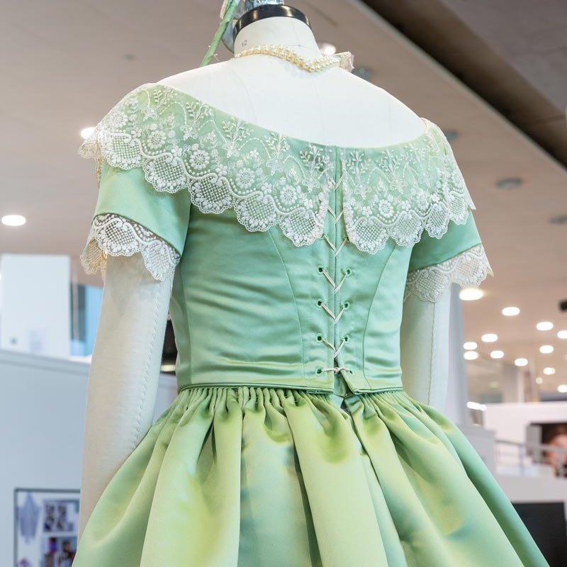 Period costume dress in pale green on a mannequin