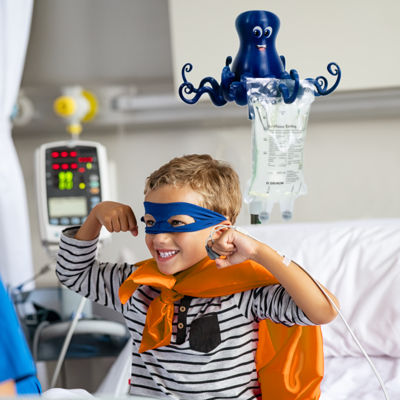 Child in hospital bed with IV drip