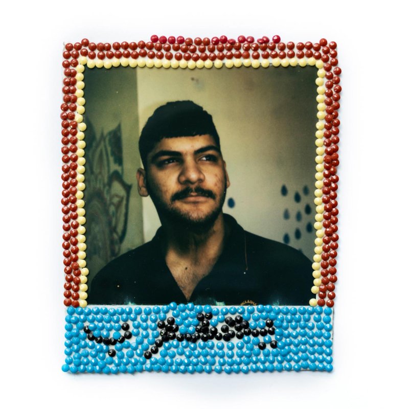 Photograph of a man with tiny circles framing the image