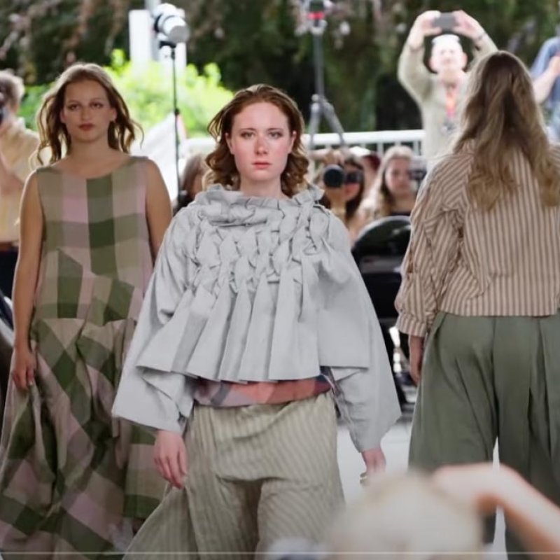 Three models on the runway at Falmouth University Graduate Fashion Show 2025