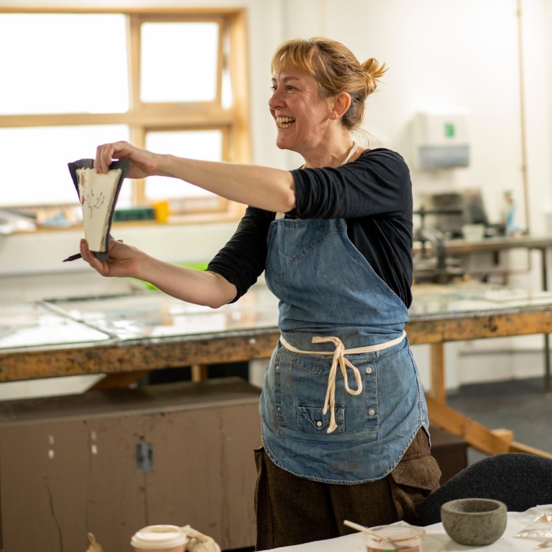 Artist Caroline Ross leading a paint-making workshop 