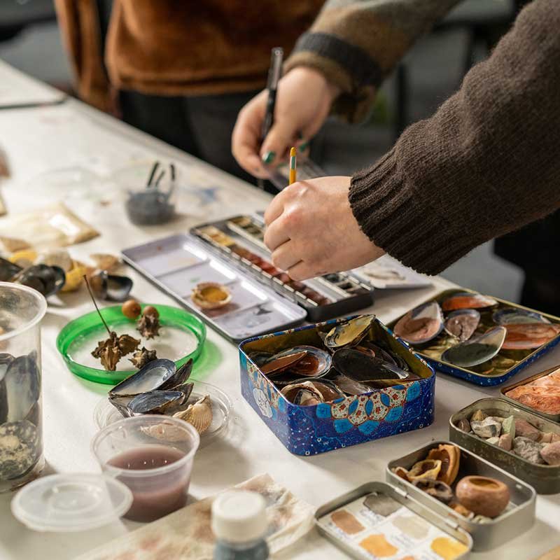 Students painting in a workshop at Falmouth Illustration Festival 