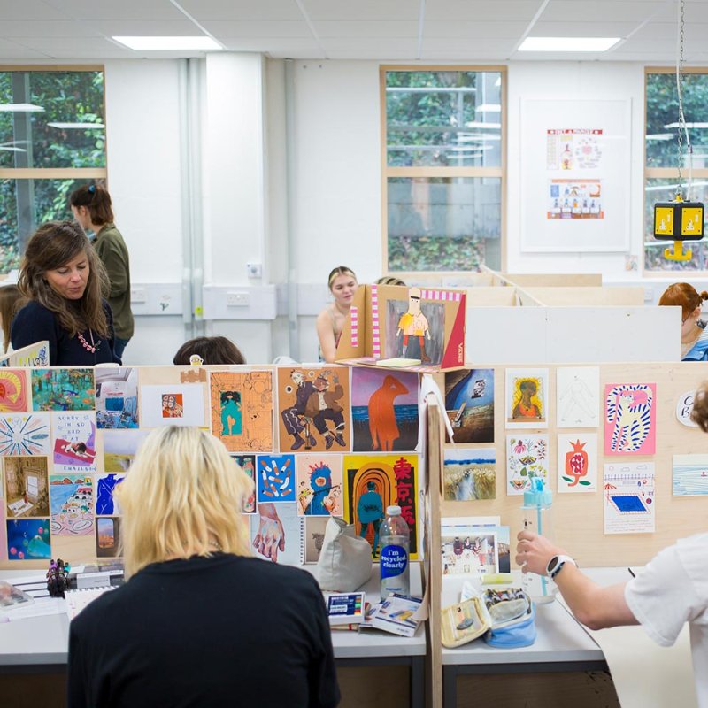 Students working in illustration studios at Falmouth University