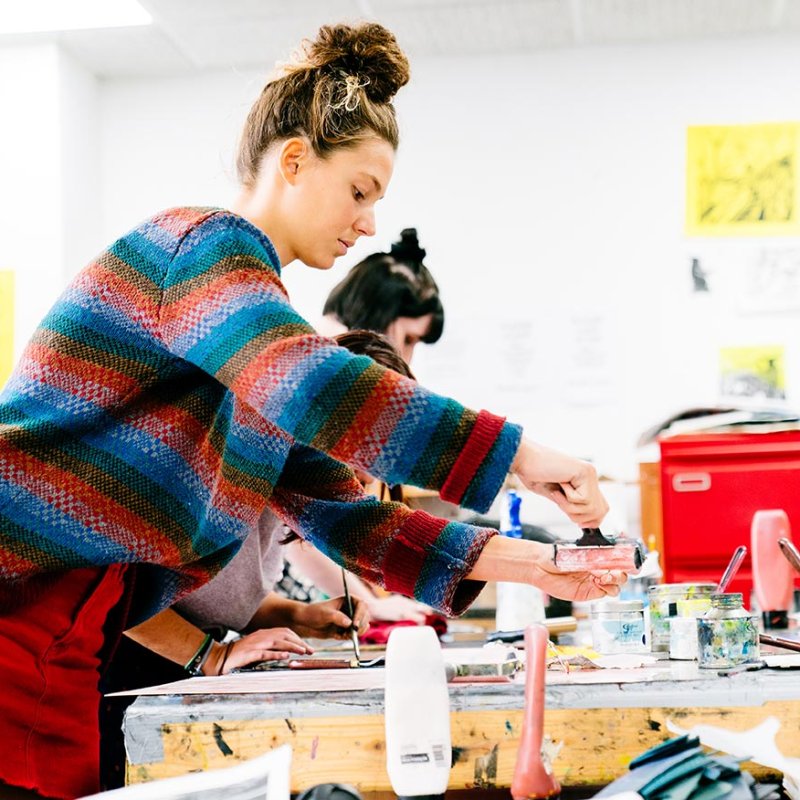 A Falmouth University student using the printmaking facilities
