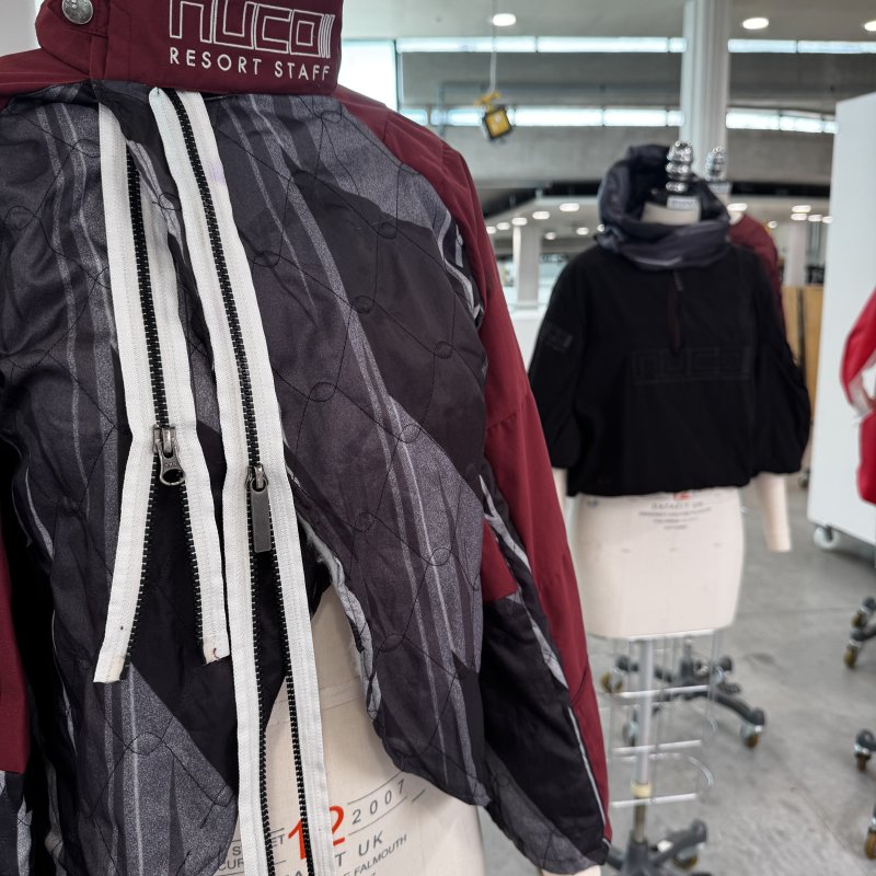 A maroon jacket on a mannequin